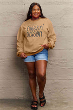 Load image into Gallery viewer, Simply Love Full Size FREEZIN&#39; SEASON Graphic Sweatshirt